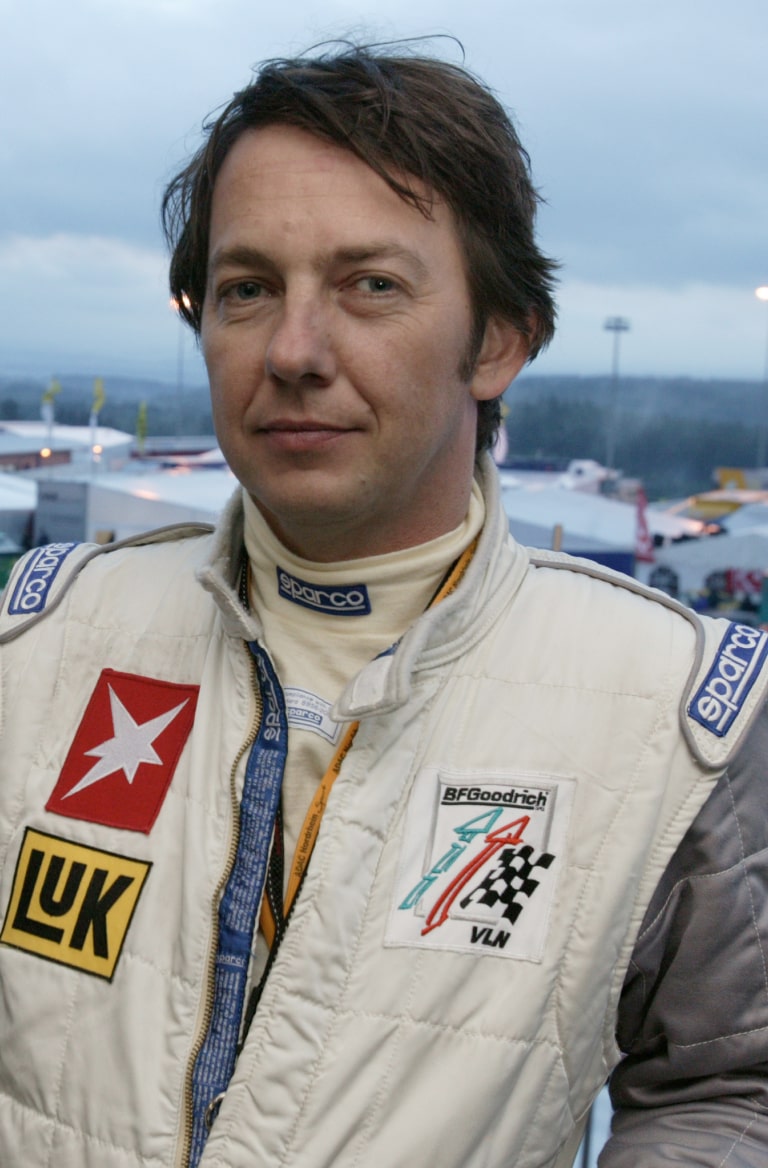 Frank Paul Janssen at 24 hours of Nuerburgring looking into camera with a smile. Photographer: Ingo Barenschee