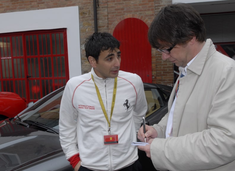 Ferrari test driver talks to Frank Paul Janssen in Maranello